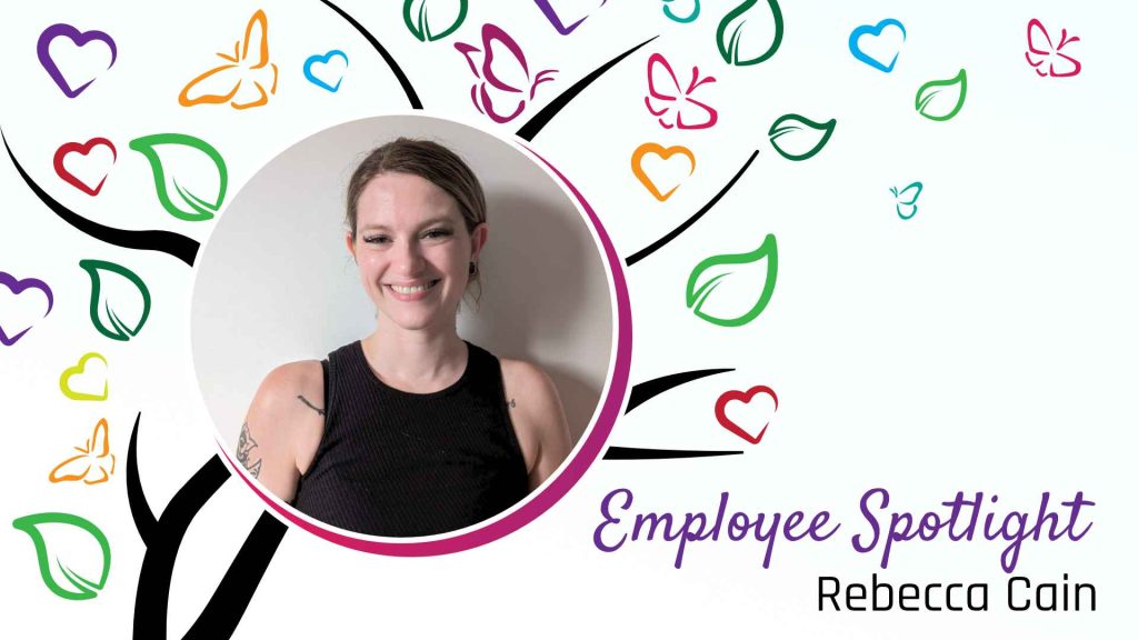 "Colorful Employee Spotlight graphic featuring Rebecca Cain, with a vibrant background of hearts, leaves, and butterflies. 'Employee Spotlight' is written in purple and 'Rebecca Cain' in black.