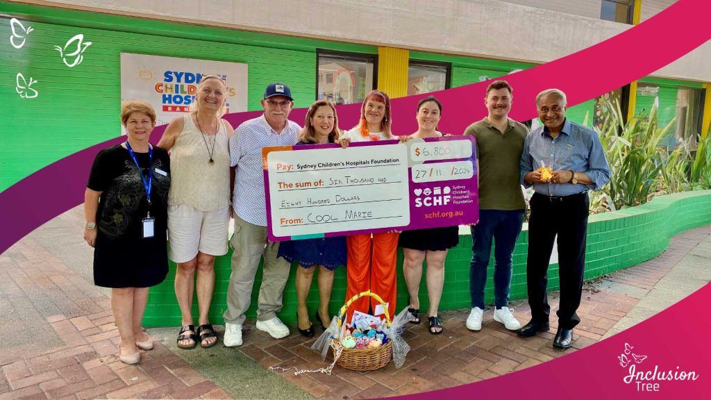 A group of people stands in front of a green building with a sign reading 'Sydney Children’s Hospital.' They are holding a large ceremonial cheque made out to the 'Sydney Children’s Hospitals Foundation' for the amount of $6,800, dated 27/11/2024, and from 'COOL MARIE.' There is also a basket with various items placed in front of the group. The image features a purple border with white butterflies and the text 'Inclusion Tree' in the bottom right corner.