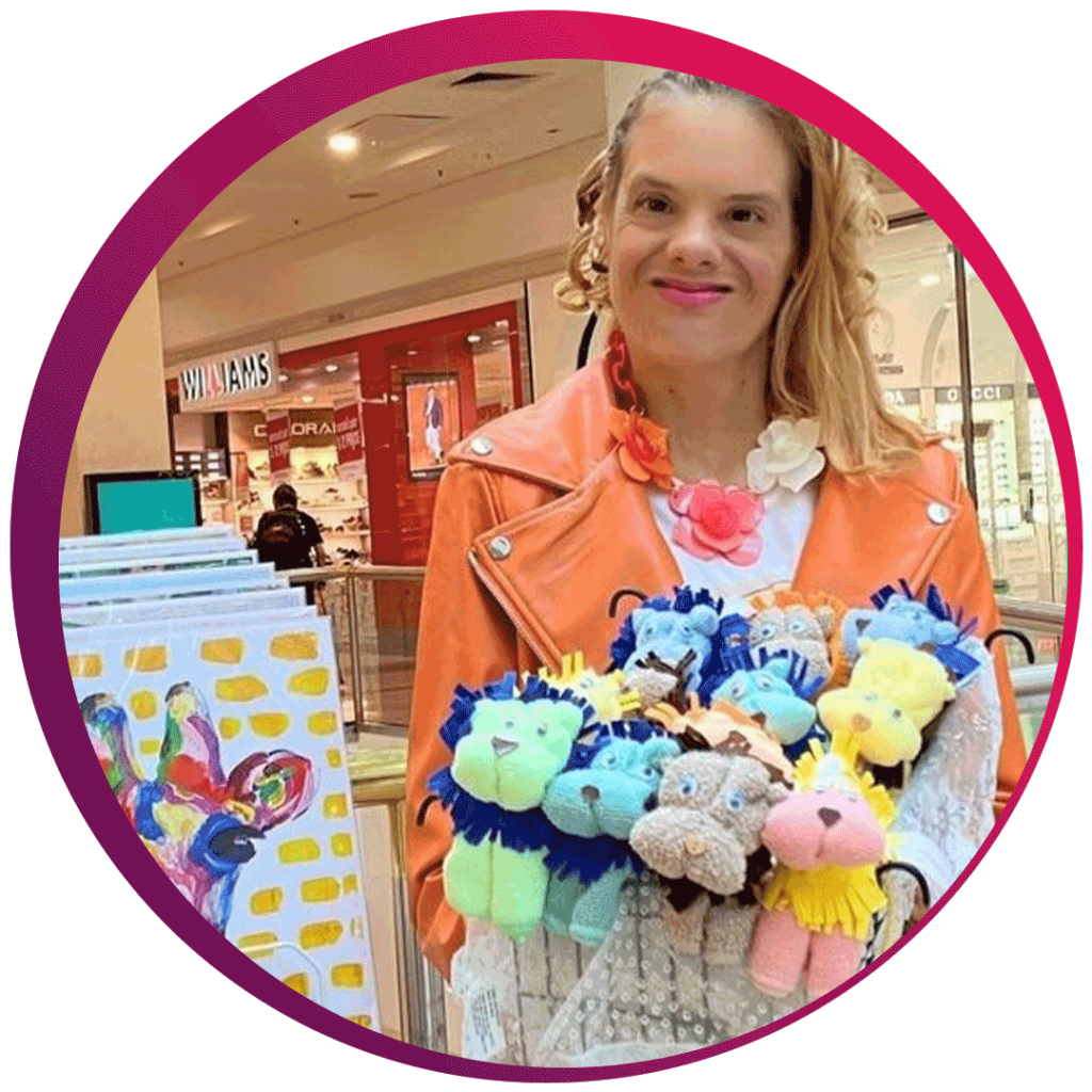 A person in an orange jacket is holding a collection of colorful, plush lion toys. In the background, there is a shopping mall with various stores, including one named 'WILLIAMS.' To the left of the person, there is a display stand with colourful artwork.