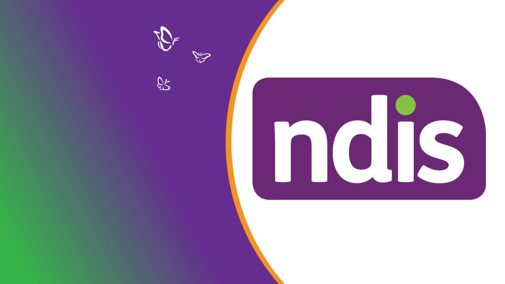 Graphic featuring the National Disability Insurance Scheme (NDIS) logo. The logo shows the lowercase letters ‘ndis’ in white inside a rounded purple rectangle, with a small green dot above the ‘i’. The background fades diagonally from green at the bottom left to purple at the top right. On the left side, three small white butterfly illustrations float across the purple area. A curved orange line separates the purple and white sections of the design.