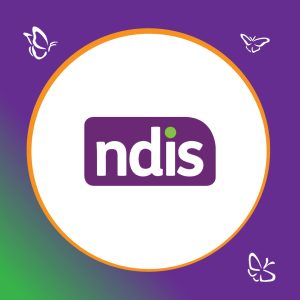 Logo for the National Disability Insurance Scheme (NDIS). The design features the lowercase letters ‘ndis’ in white on a purple rounded rectangle, with a small green dot above the ‘i’. The logo sits inside a white circle bordered by orange, on a purple background with a green gradient in the lower left corner. Three white butterfly illustrations appear around the circle.